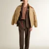 Beige bomber jacket with leather and patch details
