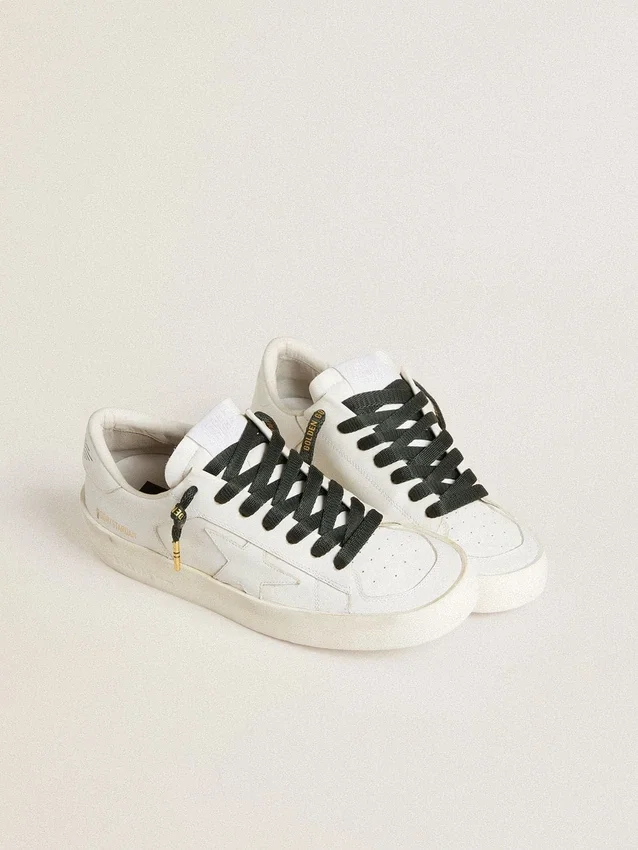 Dark green cotton laces with contrasting gold-colored logo