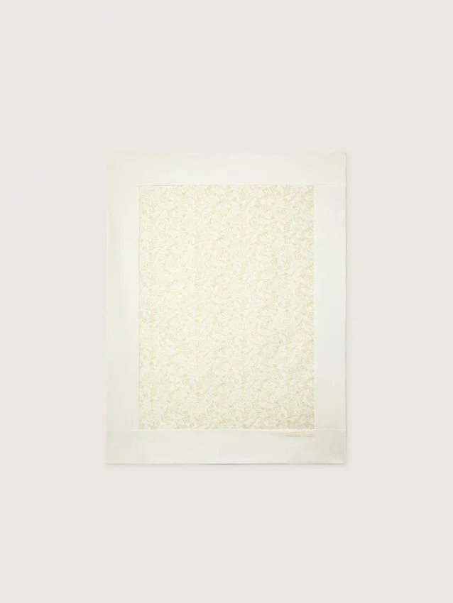 Journey Baby blanket in white cotton fleece with peach-pink mascot print