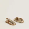 Maxime Young sandals in gold leather