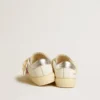 May Young with fuchsia glitter star and metallic leather heel tab
