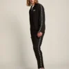 Men's black joggers with white stars on the sides