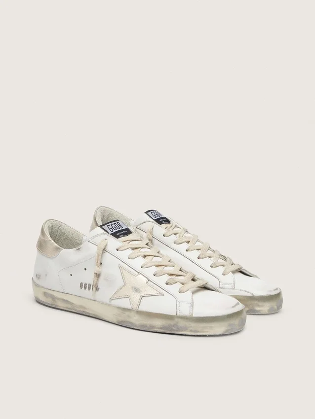 Women's Super-Star with gold sparkle foxing and metal stud lettering