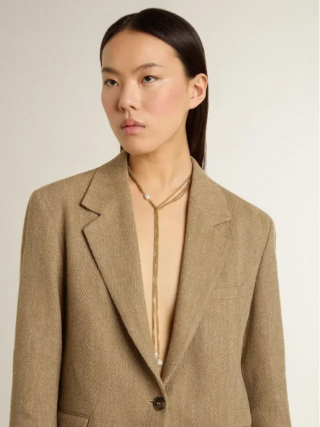 Necklace with antique gold-colored chains with pearls