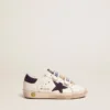 Old School Junior in white leather with blue suede star and heel tab