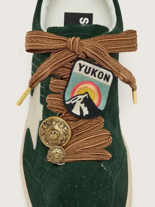 Skins burgundy and peach embroidered laces with patch and two charms