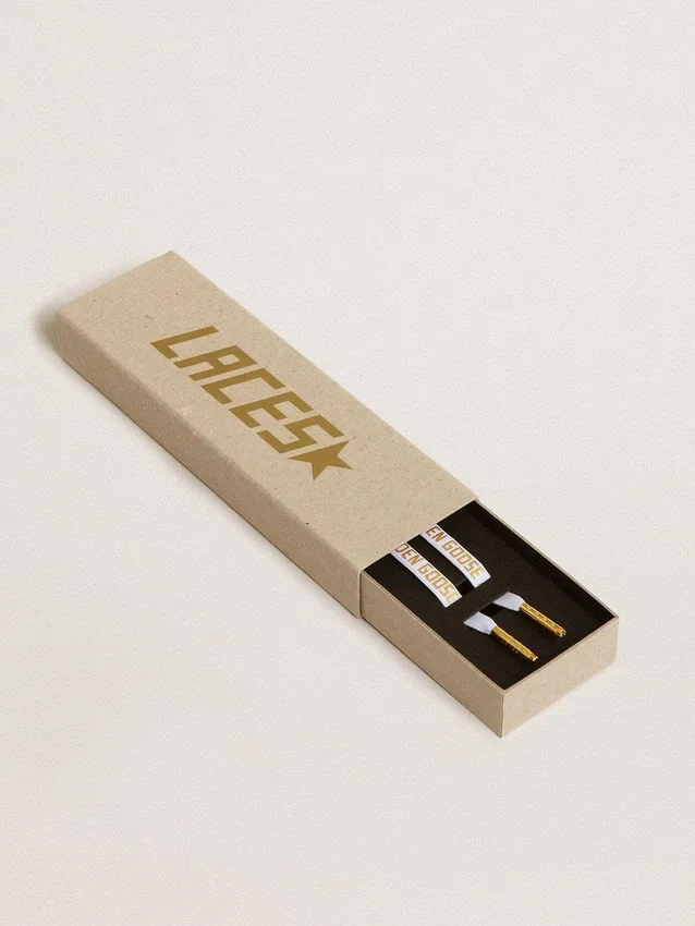 White cotton laces with contrasting gold logo