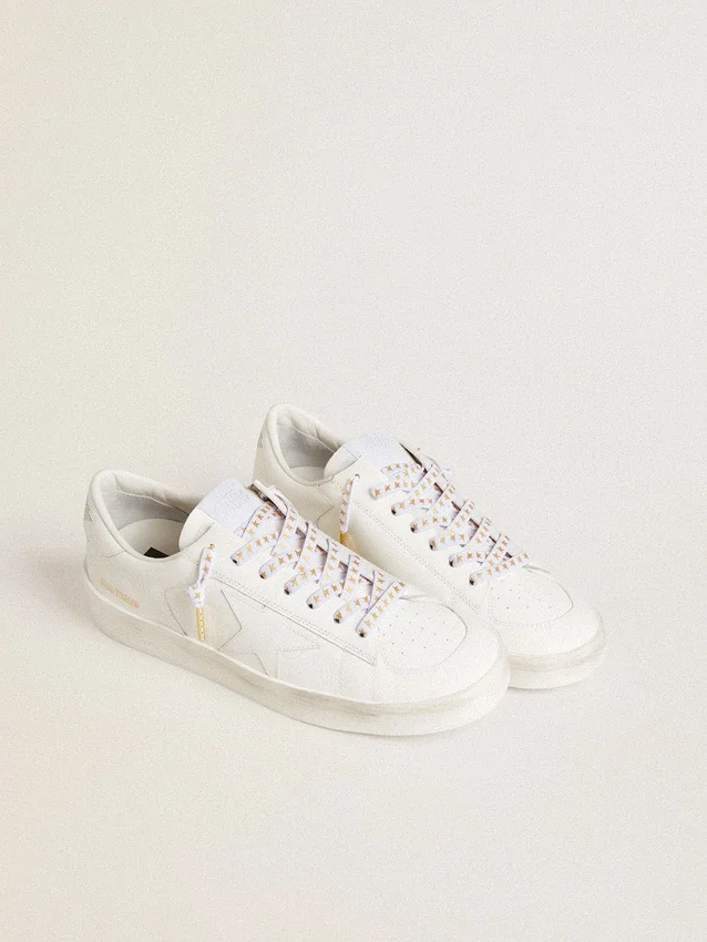 White cotton laces with contrasting gold stars