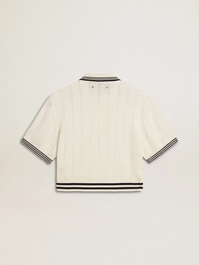 Women's cropped worn-white cotton polo shirt with blue ribbing