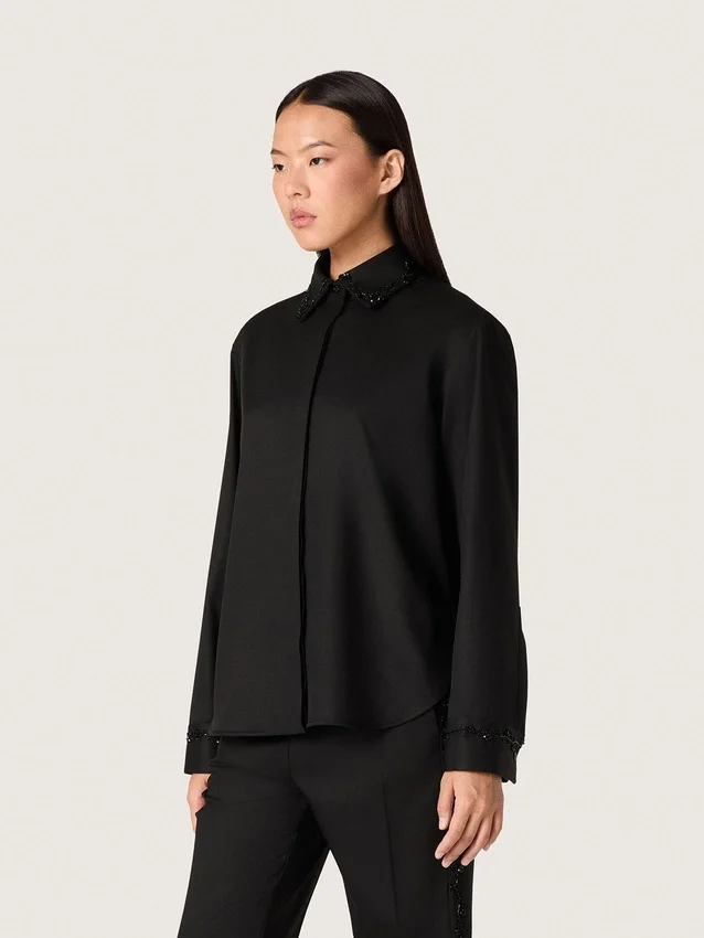 Women's shirt in black wool twill with floral embroidery in glass beads