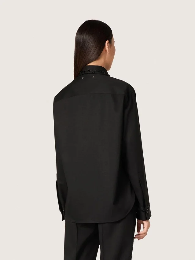 Women's shirt in black wool twill with floral embroidery in glass beads