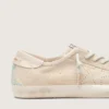 Women’s Super-Star in cream suede with perforated star and bead insert