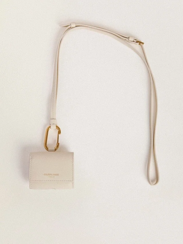 Worn white AirPod case