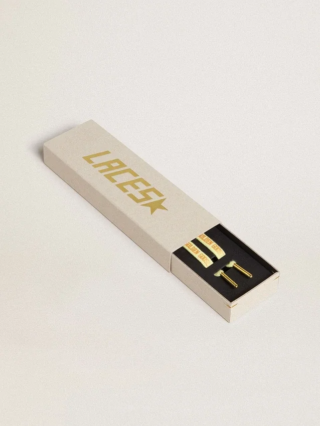 Yellow cotton laces with contrasting gold-colored logo