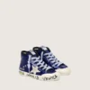 Young Francy Penstar in blue sequins with white suede star