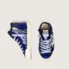 Young Francy Penstar in blue sequins with white suede star