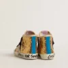 Young Francy Penstar in gold sequins with ice-gray suede star